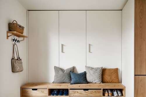 photo from pinterest of airbnb-style interior designed (drop zone interior) with a bench and cubbies and cabinets and wall hooks for coats and storage drawers and shelves for shoes and storage baskets and lockers. . with practicality and functionality and open and natural lighting and neutral walls and textures and natural materials and elements and scandinavian style and simple, clean lines and simplistic furniture and simple color palette and practicality and functionality. . cinematic photo, highly detailed, cinematic lighting, ultra-detailed, ultrarealistic, photorealism, 8k. trending on pinterest. airbnb interior design style. masterpiece, cinematic light, ultrarealistic+, photorealistic+, 8k, raw photo, realistic, sharp focus on eyes, (symmetrical eyes), (intact eyes), hyperrealistic, highest quality, best quality, , highly detailed, masterpiece, best quality, extremely detailed 8k wallpaper, masterpiece, best quality, ultra-detailed, best shadow, detailed background, detailed face, detailed eyes, high contrast, best illumination, detailed face, dulux, caustic, dynamic angle, detailed glow. dramatic lighting. highly detailed, insanely detailed hair, symmetrical, intricate details, professionally retouched, 8k high definition. strong bokeh. award winning photo.